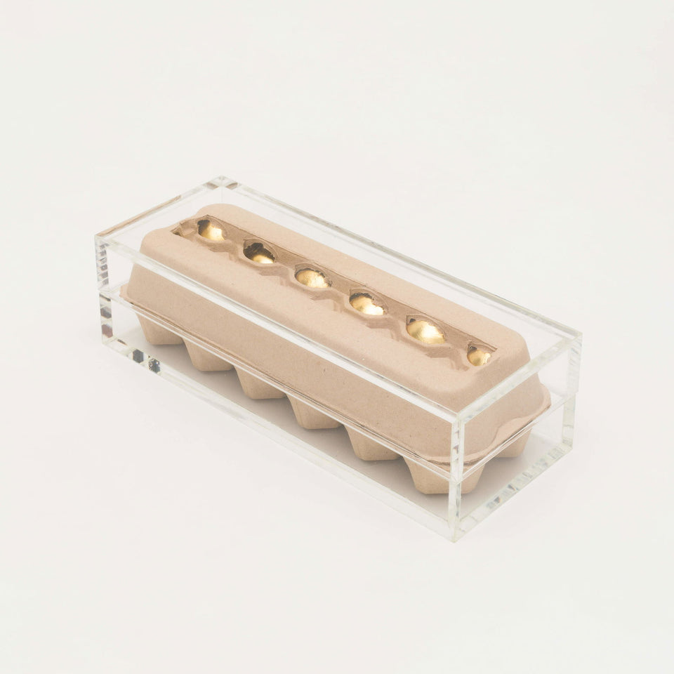 Ovos de ouro - Carbono Galeria